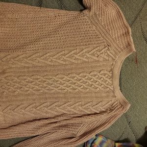 A light pink knit sweater